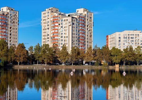 Lake with trees and buildings, reflected in the water, Valea Trandafirilor, Chisinau, Moldova